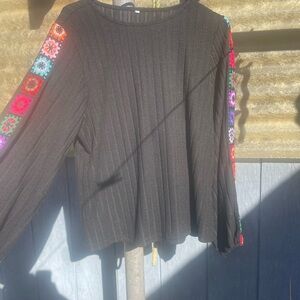 Black Long-Sleeve Knit Top with Multicolor Embroidered Sleeve Detail